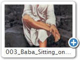 003 baba sitting on stone